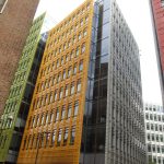 A modern glass office building in a city centre.
