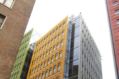 A modern glass office building in a city centre.