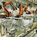 Workers on a modern factory production line
